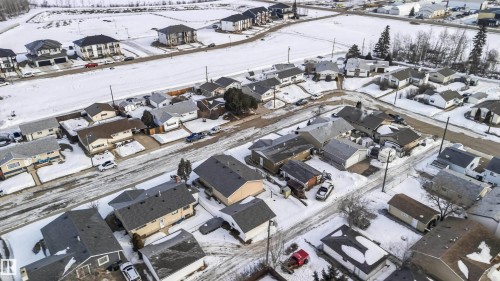 Snowy aerial view with a residential view - 4615 49 Avenue, Redwater, AB - 