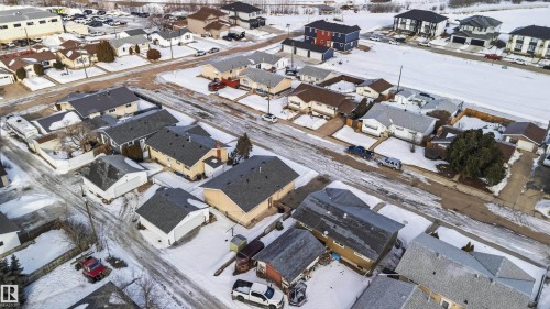 Snowy aerial view featuring a residential view - 4615 49 Avenue, Redwater, AB - Outdoor With View