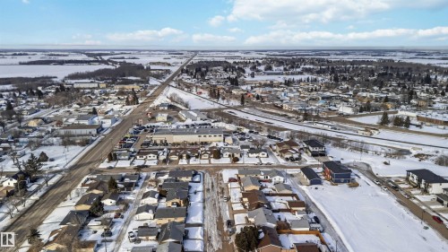 Snowy aerial view with a residential view - 4615 49 Avenue, Redwater, AB - Outdoor With View