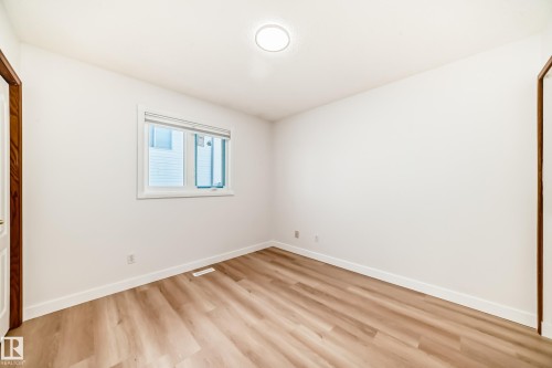 Unfurnished bedroom with light wood finished floors and a closet - 14063 128 Street, Edmonton, AB - Indoor Photo Showing Other Room