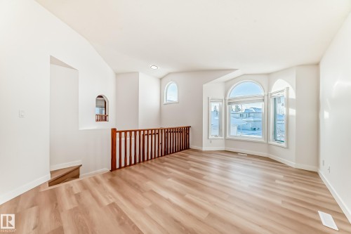 Spare room with light wood-style flooring and baseboards - 14063 128 Street, Edmonton, AB - Indoor Photo Showing Other Room