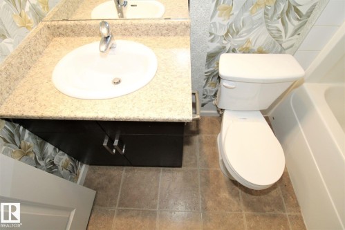 Bathroom with toilet and vanity - 430 5515 7 Avenue, Edmonton, AB - Indoor Photo Showing Bathroom