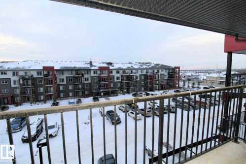 View of snow covered back of property - 430 5515 7 Avenue, Edmonton, AB - Outdoor With Balcony