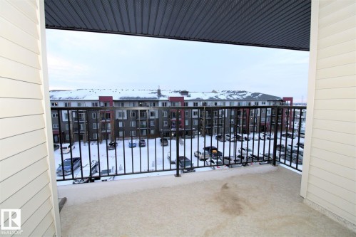 View of snow covered back of property - 430 5515 7 Avenue, Edmonton, AB - Outdoor With Exterior