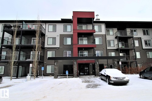 Snow covered building featuring a view of apartment building / complex - 430 5515 7 Avenue, Edmonton, AB - Outdoor With Balcony With Facade