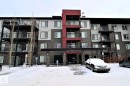 Snow covered building featuring a view of apartment building / complex - 430 5515 7 Avenue, Edmonton, AB  - Outdoor With Balcony With Facade 