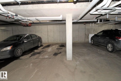 Garage with a parking garage - 430 5515 7 Avenue, Edmonton, AB - Indoor Photo Showing Garage