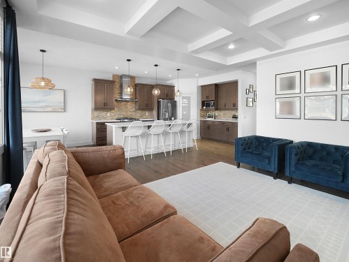 Living area featuring coffered ceiling, dark wood-type flooring, and recessed lighting - 3387 Parker Loop, Edmonton, AB - Indoor