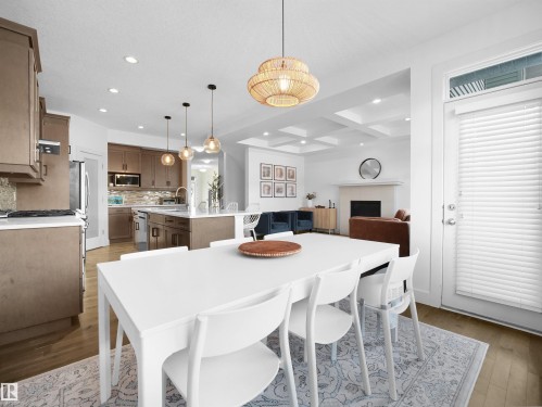 Dining space featuring recessed lighting, dark wood-type flooring, and coffered ceiling - 3387 Parker Loop, Edmonton, AB - Indoor Photo Showing Dining Room