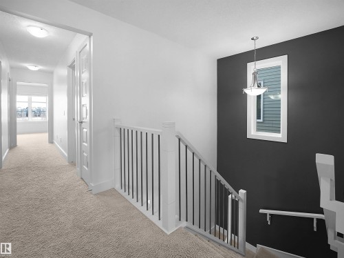 Corridor featuring an upstairs landing and light colored carpet - 3387 Parker Loop, Edmonton, AB - Indoor Photo Showing Other Room