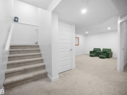Stairway featuring carpet floors and baseboards - 