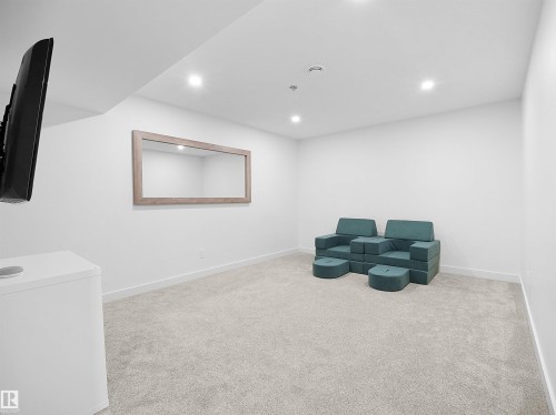 Sitting room with light colored carpet and recessed lighting - 3387 Parker Loop, Edmonton, AB - Indoor