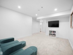 Sitting room featuring light carpet and recessed lighting - 