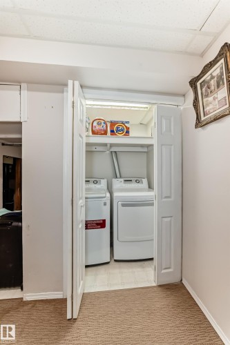 Laundry area featuring a washer and dryer, located within a bi-fold door closet - 11532 9 Avenue, Edmonton, AB - Indoor Photo Showing Laundry Room