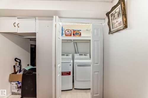The property features a dedicated laundry area with a washer and dryer, conveniently located within a closet with bi-fold doors - 11532 9 Avenue, Edmonton, AB - Indoor Photo Showing Laundry Room