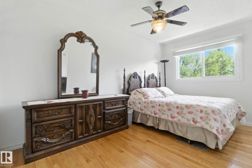 Bedroom with light wood-type flooring and a ceiling fan - 39 Grand Meadow Crescent, Edmonton, AB - Indoor Photo Showing Bedroom