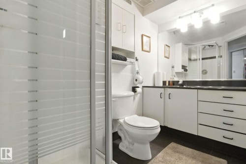 Full bathroom with vanity, a shower stall, and dark tile patterned flooring - 39 Grand Meadow Crescent, Edmonton, AB - Indoor Photo Showing Bathroom