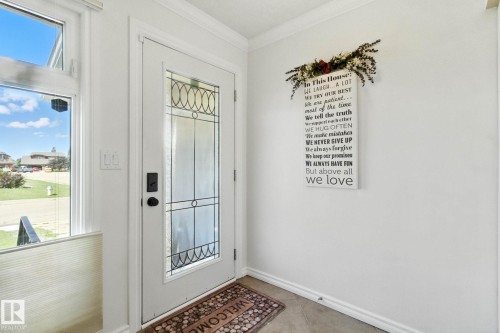 Doorway to outside with ornamental molding and tile patterned floors - 39 Grand Meadow Crescent, Edmonton, AB - Indoor Photo Showing Other Room