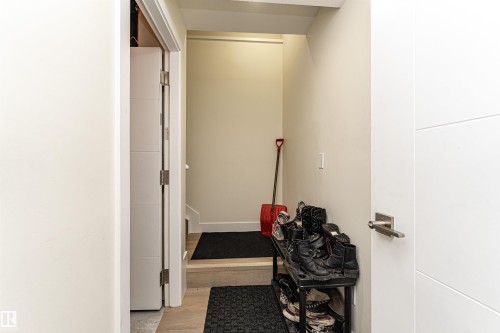 Hall with light wood-style floors - 2 11569 University Avenue, Edmonton, AB - Indoor Photo Showing Other Room