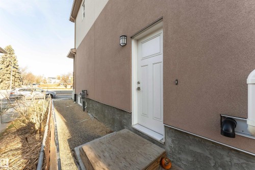 Property entrance featuring stucco siding - 2 11569 University Avenue, Edmonton, AB - Outdoor With Exterior