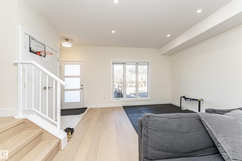 Foyer featuring light wood-style flooring and recessed lighting - 2 11569 University Avenue, Edmonton, AB - Indoor Photo Showing Other Room