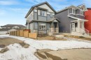 View of front facade with stone siding - 2428 Wonnacott Crest, Edmonton, AB  - Outdoor With Facade 