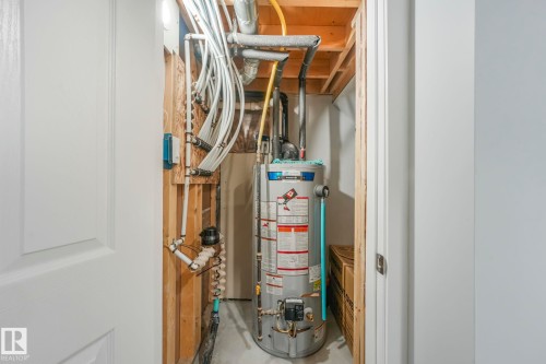 Utility room with water heater - 2428 Wonnacott Crest, Edmonton, AB - Indoor Photo Showing Basement