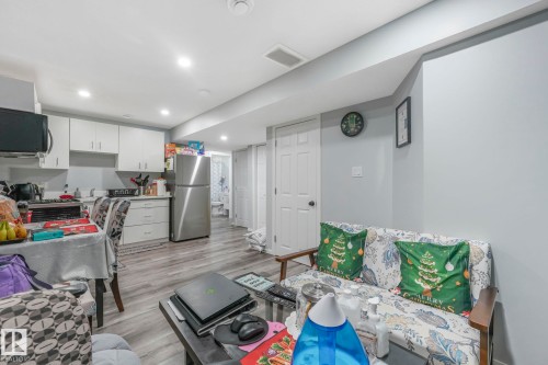 Living room featuring light wood finished floors and recessed lighting - 2428 Wonnacott Crest, Edmonton, AB - Indoor