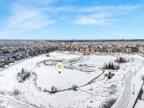 Snowy aerial view featuring a residential view - 2428 Wonnacott Crest, Edmonton, AB - Outdoor With View