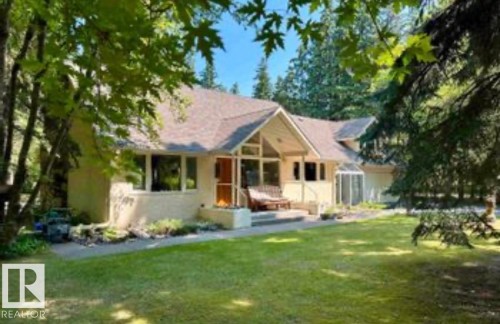 Back of house with a lawn and a porch - 14 Wedgewood Crescent Nw, Edmonton, AB 