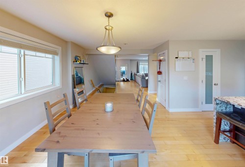 Dining area with light wood-style flooring - 8 9535 217 Street, Edmonton, AB - Indoor Photo Showing Dining Room
