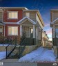 View of front of home featuring board and batten siding and a porch - 8 9535 217 Street, Edmonton, AB  - Outdoor 