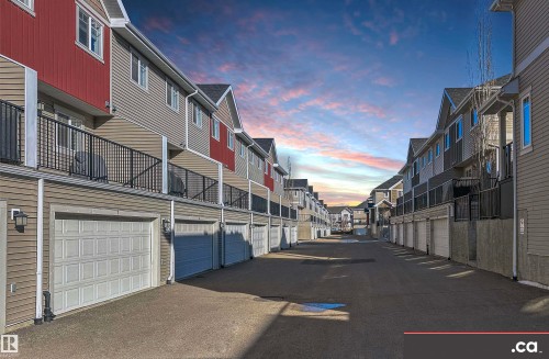 View of asphalt road - 8 9535 217 Street, Edmonton, AB - Outdoor With Balcony With Exterior