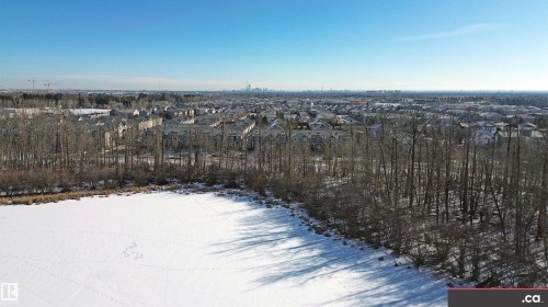 Snowy aerial view featuring a residential view - 8 9535 217 Street, Edmonton, AB - Outdoor With View
