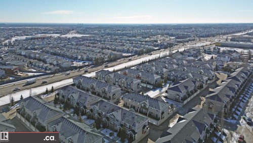 Aerial perspective of suburban area - 8 9535 217 Street, Edmonton, AB - Outdoor With View