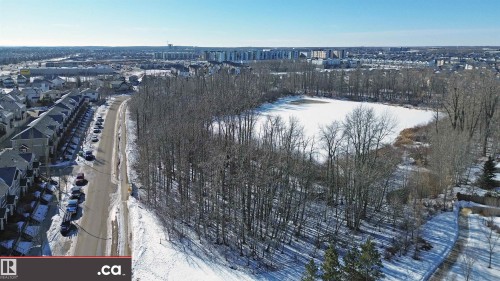 View of snowy aerial view - 8 9535 217 Street, Edmonton, AB - Outdoor With View