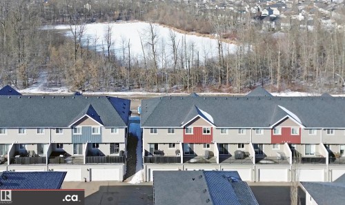 Drone / aerial view of a heavily wooded area and a large body of water - 8 9535 217 Street, Edmonton, AB - Outdoor