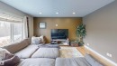 Living room with light wood-type flooring, recessed lighting, and a textured ceiling - 8 9535 217 Street, Edmonton, AB  - Indoor Photo Showing Living Room 