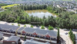 End-unit townhome featuring a private balcony and a two-story exterior - 