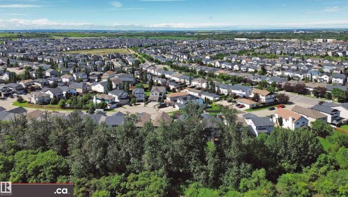 Expansive residential area featuring numerous detached homes with varied architectural styles and rooflines - 8 9535 217 Street, Edmonton, AB 