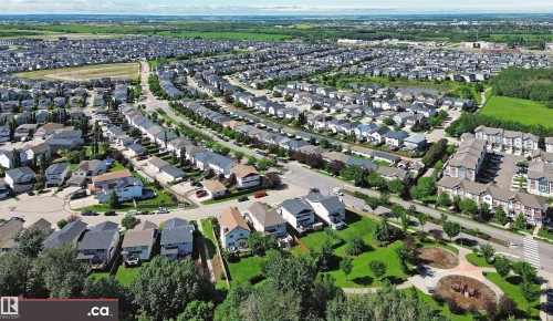 Aerial perspective showcasing a residential development with varied housing styles - 8 9535 217 Street, Edmonton, AB 