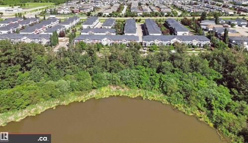 Expansive natural water feature bordering a residential community - 8 9535 217 Street, Edmonton, AB 