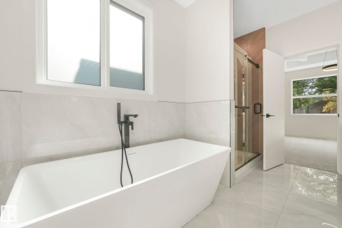 Full bath with a soaking tub and a stall shower - 10965 129 Street, Edmonton, AB - Indoor Photo Showing Bathroom