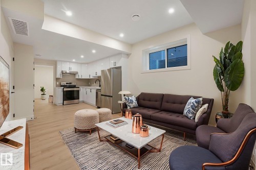 Living room featuring light wood-style floors and recessed lighting - 10965 129 Street, Edmonton, AB - Indoor Photo Showing Living Room
