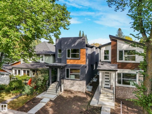 Contemporary home featuring stone siding and stucco siding - 10965 129 Street, Edmonton, AB - Outdoor With Facade