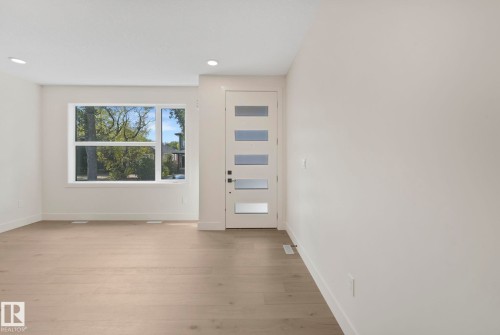 Foyer with light wood-type flooring and recessed lighting - 10965 129 Street, Edmonton, AB - Indoor Photo Showing Other Room