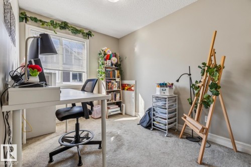Office area featuring light colored carpet and a textured ceiling - 5409 3 Avenue, Edmonton, AB - Indoor