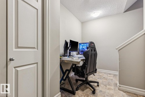 Office featuring a textured ceiling and stone finish floors - 5409 3 Avenue, Edmonton, AB - Indoor Photo Showing Office