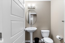Bathroom featuring toilet and baseboards - 