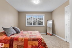 Bedroom featuring carpet flooring and a textured ceiling - 